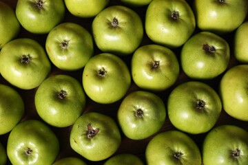 Fresh ripe green apples on wooden table, top view