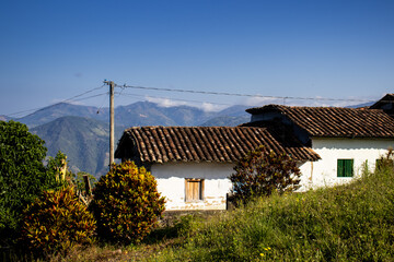 Obraz premium Rural house and mountains at the beautiful heritage town of Salamina in the department of Caldas in Colombia