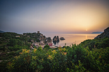 Cliffs on the coast in summer in Scopello near of Castellammare del Golfo in Sicily, Italy. June 2023, long exposure picture, sunrise time. © Сергій Вовк