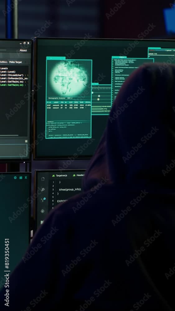 Poster vertical video experienced hacker writing lines of code on computer from underground bunker, tying t