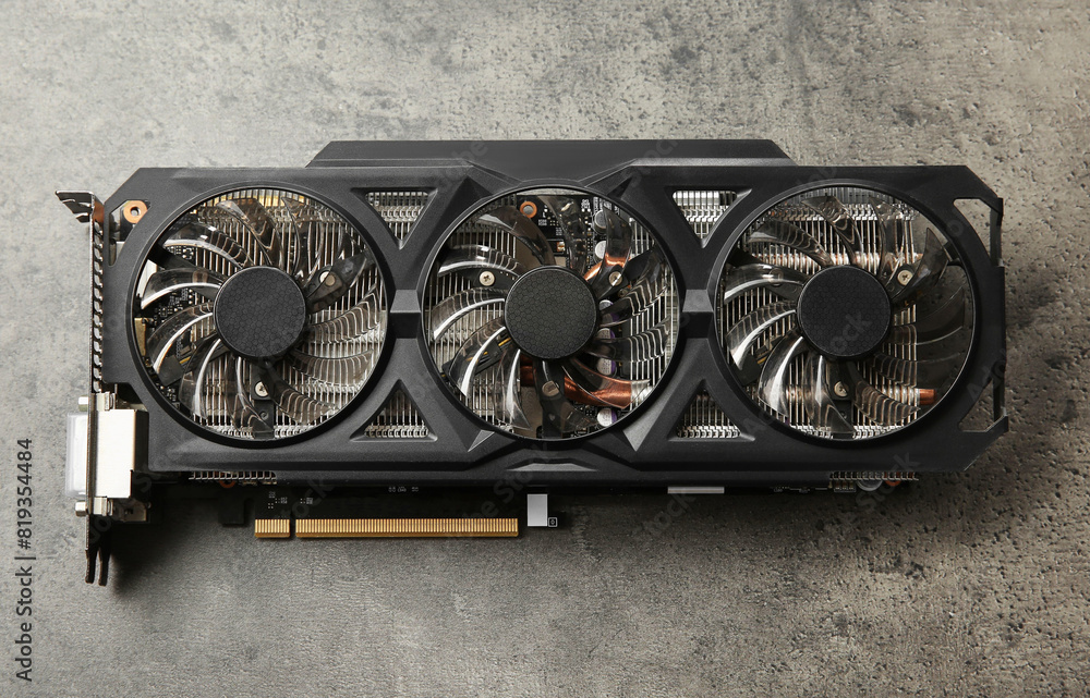 Poster one computer graphics card on grey textured table, top view