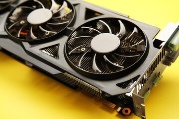 One graphics card on yellow background, closeup