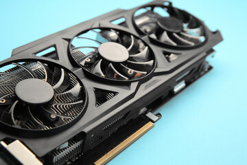 One graphics card on light blue background, closeup