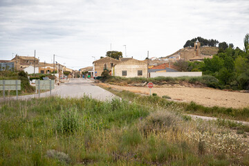a paved road entering Erla village, comarca of Cinco Villas, province of Zaragoza, Aragon, Spain