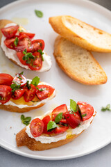 Fresh tomato bruschetta with olive oil drizzle