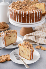 Delicious crumb cake with icing on plate