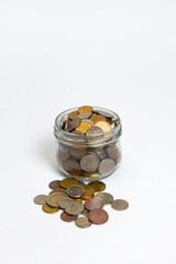 Glass jar with coins on white background, top view.  Business concept, Investment concept saving planning or income accumulation. Economic growth. Business management. Capital accumulation.
