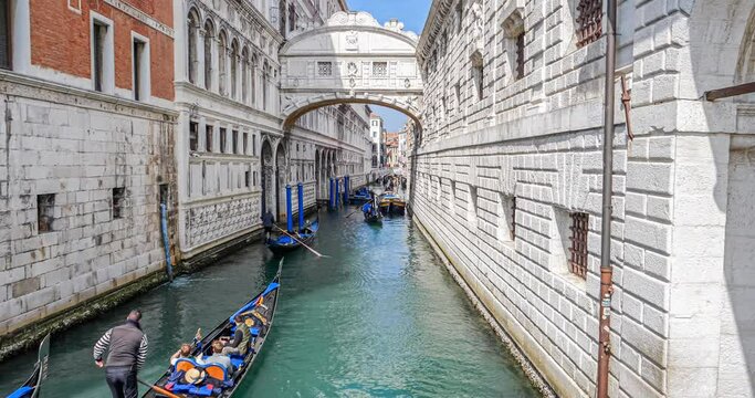 Bridge of Sighs in Venice, Italy with gondolas passing by