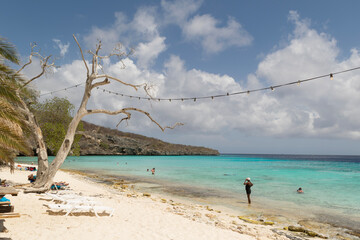 Caribbean Paradise: Beachgoers Bask in Sunny Serenity at Tropical Paradise, Curacao