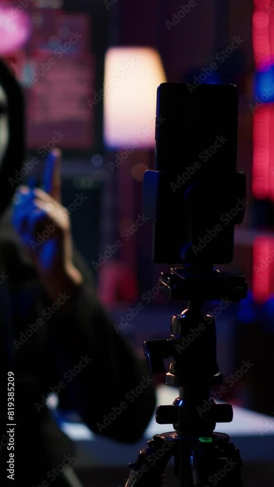 Aufkleber vertical video focus on camera on phone on tripod used by hacker concealing identity filming ransom 