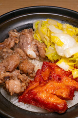 angle view Orleans-style Chicken Cutlet and Black Bean Spare Rib Claypot Rice at vertical composition