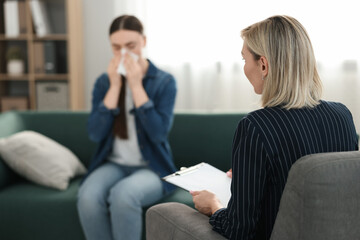Fototapeta premium Professional psychotherapist working with patient in office