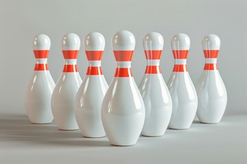 A row of bowling pins with red stripes