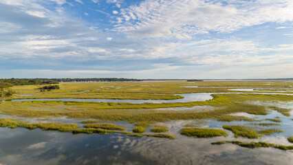 Fototapeta premium Drone landscape of low country marsh views at sunset