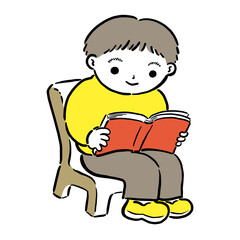 椅子に座って本を読む男の子