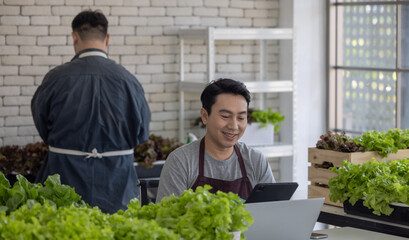 Vegetable Sellers Using Laptop for Inventory Management in Indoor Urban Market