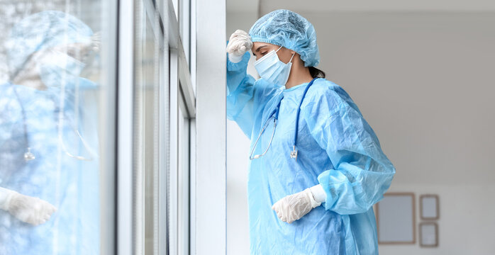 Stressed female surgeon in clinic