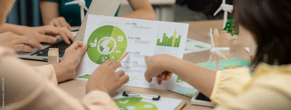Poster professional businessman interested in invested in green businesses when he see rising graph on tabl
