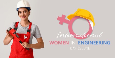 Banner for International Women in Engineering Day with female worker holding pipe wrench