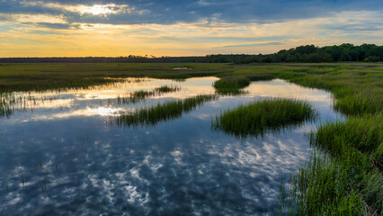 Aerial reflection at sunset low country marsh