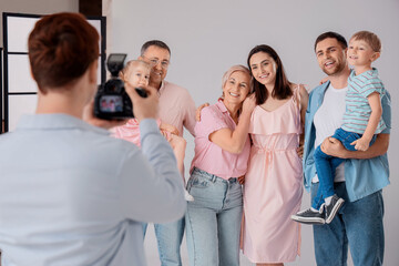 Big happy family having photo shoot in studio