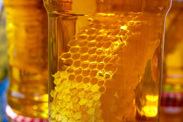 Glass jars filled with honey. Gabala. Azerbaijan.