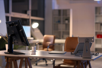Nurse's workplace with computer at hospital in evening
