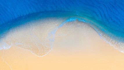 Top view nature of the beach and sea Summer with sunshine, sandy beaches, clear blue waters sparkling against the blue sky. on island with good ecology and environment Background for summer vacation