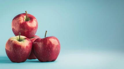 Apples, a photorealistic illustration against pastel blue background with copy space for text or...