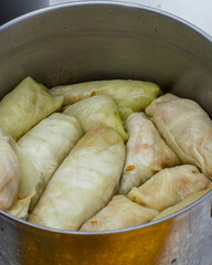Folded cabbage rolls in a pan, top view