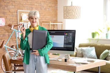 Female graphic designer with tablet in office