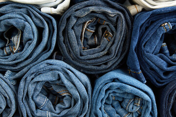 A stack of neatly rolled jeans.