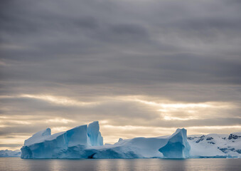 Climate Change_ Melting Antarctic Glaciers in a Warming World. Ice melts at the poles on the beach.