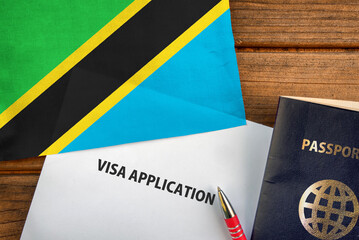 Visa application form, passport and flag of Tanzania
