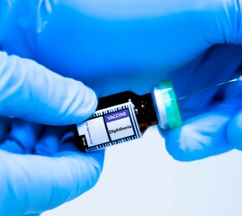 Vaccine bottles and syringes for preventing diphtheria.