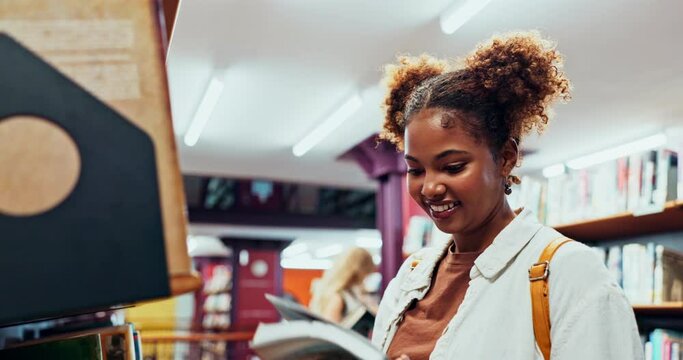 Black girl, student and choice of book in library for reading or learning, education and research knowledge for college assignment. Woman, bookshelf and check for literature textbook for essay task.