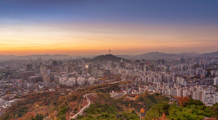 High angle view of Namsan Seoul Tower surrounded by cityscape of Seoul with sunlights in the morning, Seoul, South Korea