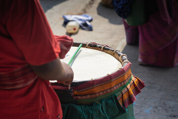 Dhak being played by dhaki during durga puja festival. This is a special drum or musical instrument...