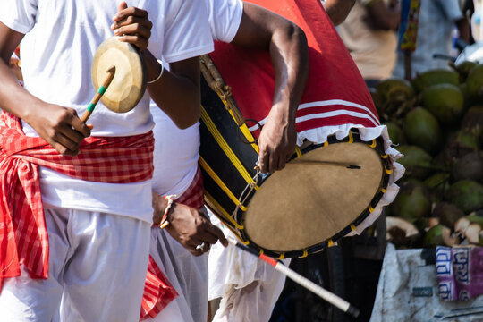 Dhak and kasar being played during Durga puja celebration in India. Kasar is a gong bell made of brass. Dhak is a traditional drum for hindu religious puja rituals.