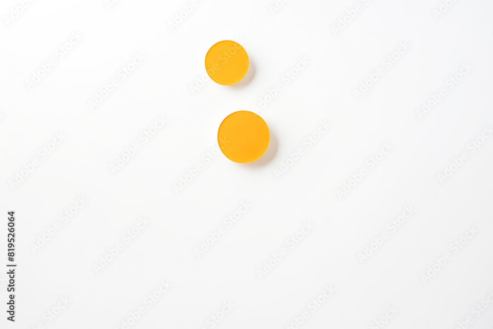 Poster two yellow round objects on white background
