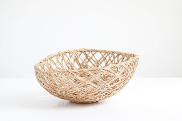 Obraz premium Wicker Basket on White Background