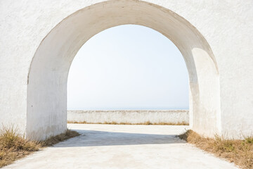 View of the Ocean Through a Stone Archway