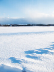 Snow, countryside and winter in landscape with clouds, sky, and sunshine in nature for mockup...