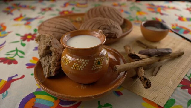 soaking a piece of sweet bread in a cup of milk, chocolate shell, slow motion 
