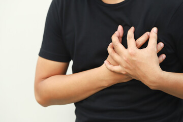 man having chest pain while exercising - heart attack. or Heavy exercise causes the body to shock...