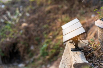 small solar cell panels at local countryside for lighting in garden agriculture to renewable energy by natural clean solar energy with save ecology by sun light to smart electrical systems technology