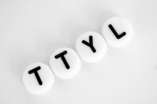 TTYL representing talk to you later text on white background