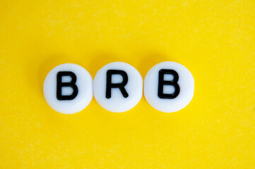 Be right back text on yellow background