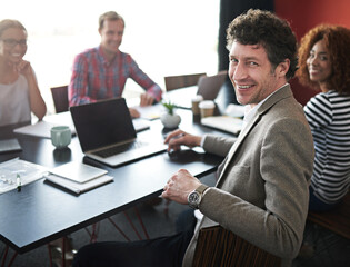 Fototapeta premium Portrait, man and boardroom for meeting with colleagues, office and corporate for planning. Professional, coworkers and conference for financial advisor, team and technology for strategy and project