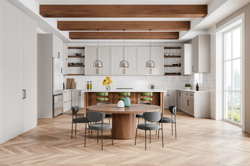Luxury home kitchen interior with dinner table and bar island, panoramic window
